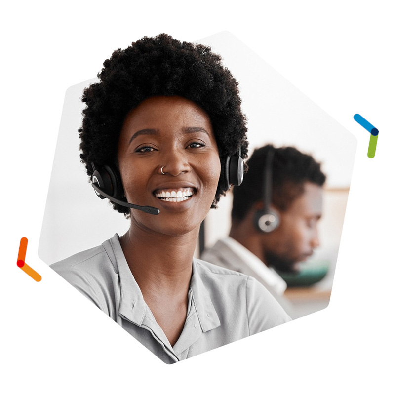 Smiling woman in call center wearing VoIP headset