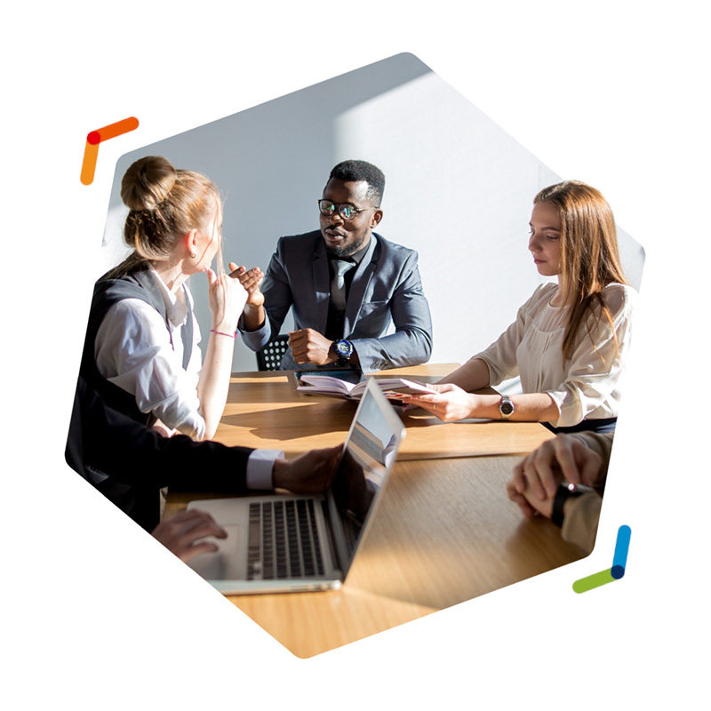 Group of business colleagues sitting around a conference table