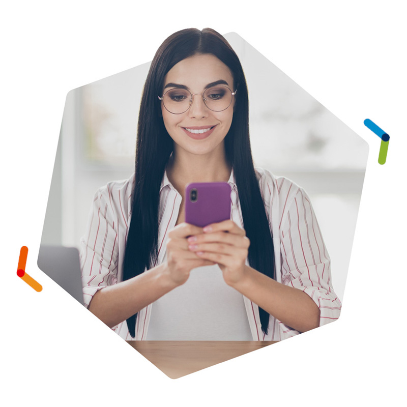 Smiling woman holding purple smartphone with both hands