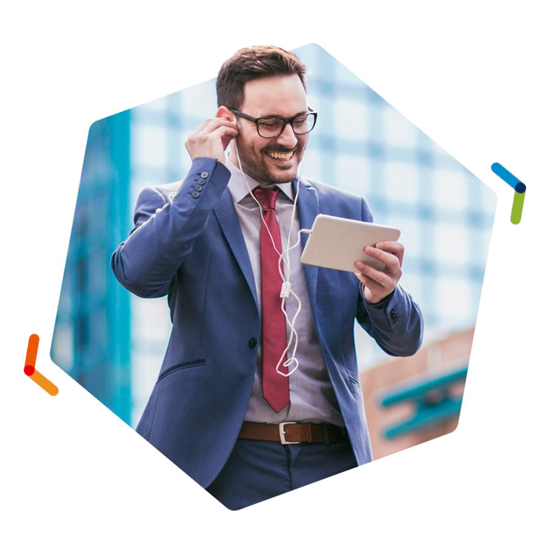 Businessman putting in earbuds while viewing smart phone