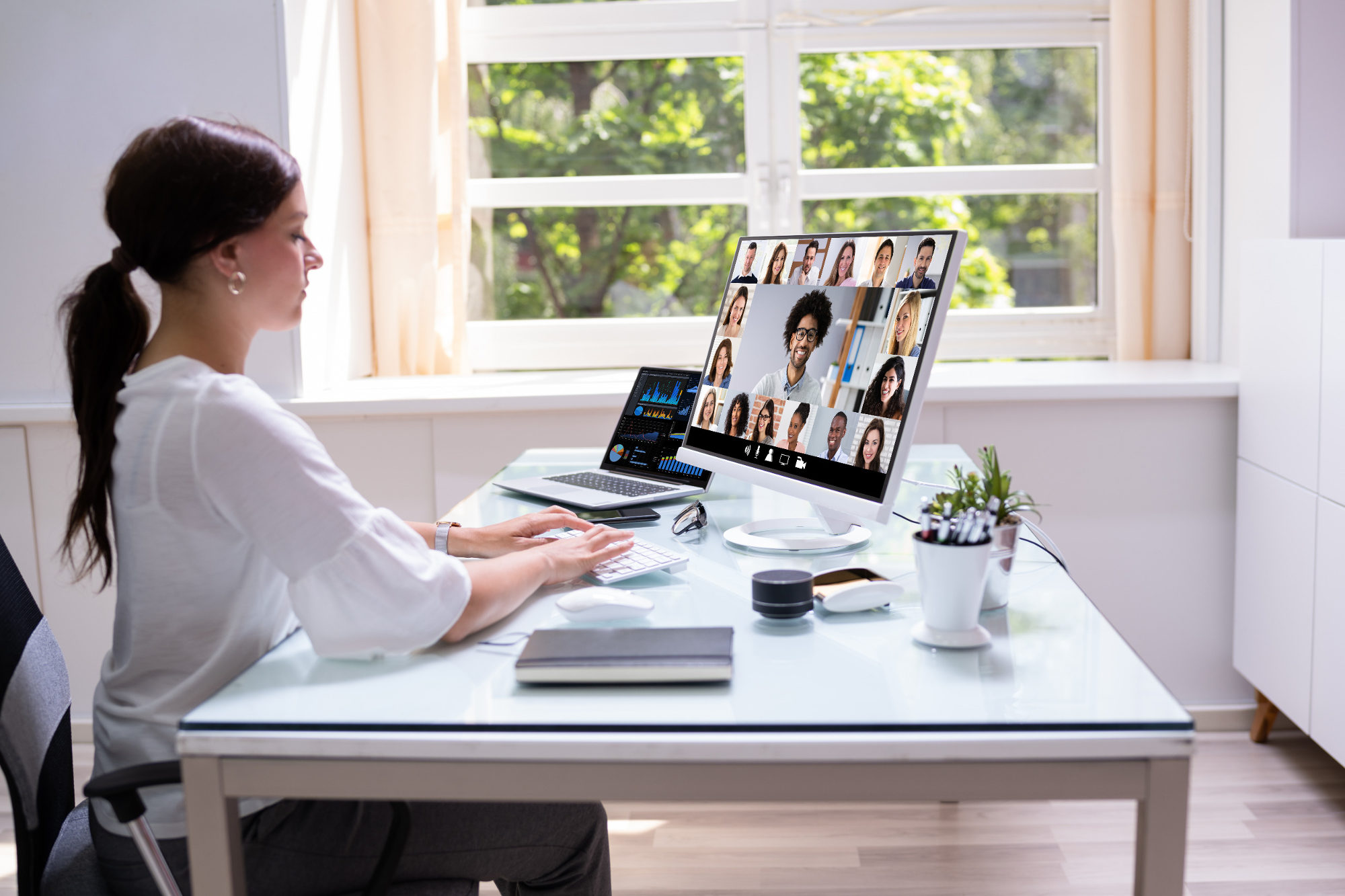 Woman in virtual telework webinar