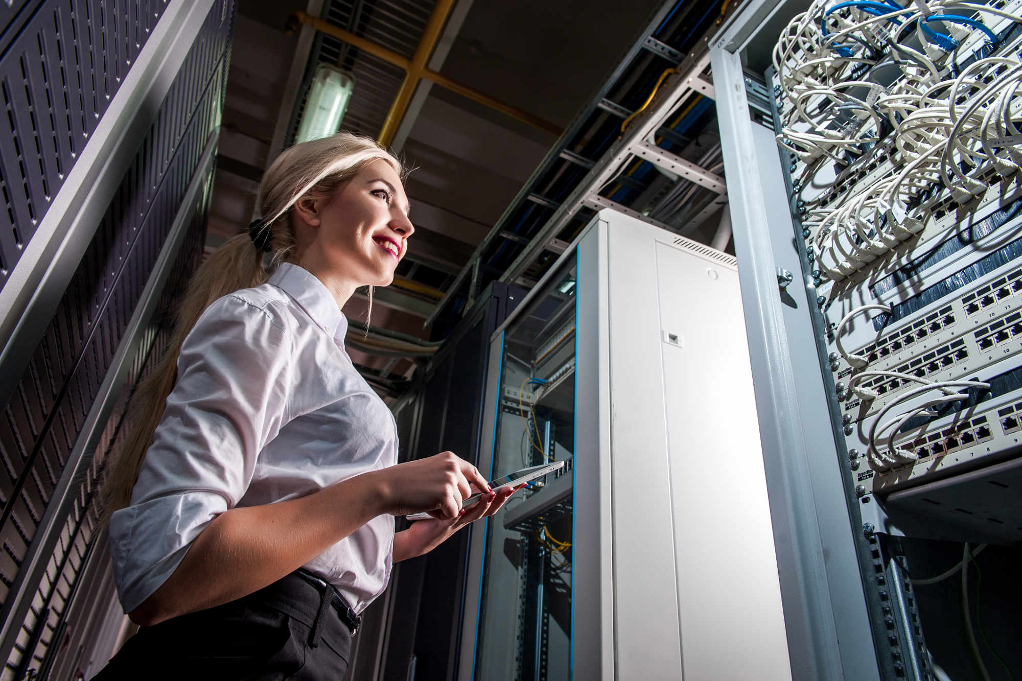 Data technician in network server room