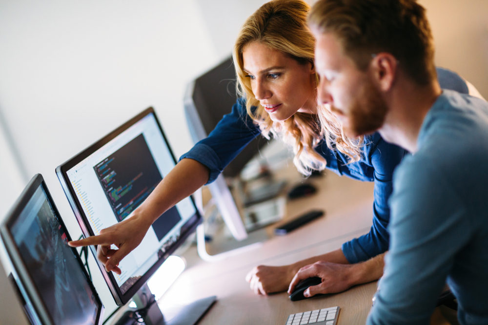 Software engineers working on project together