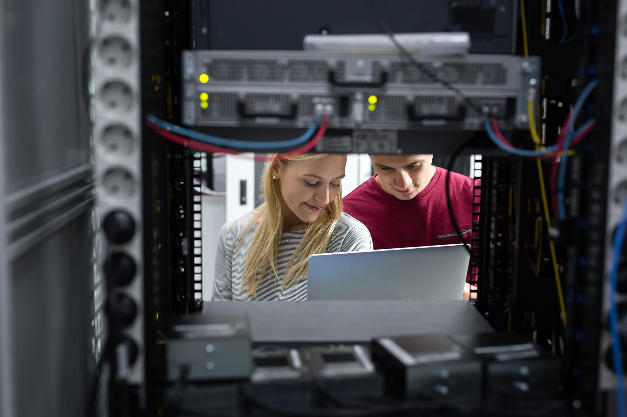 Team of technicians working together on servers